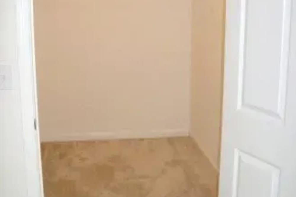 Walk-in closet at Ochlockonee Pointe Apartments in Midway, Florida