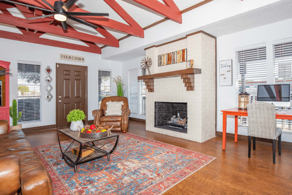 Indoor lounge with seating and tables at Fredericksburg Place Apartments in San Antonio, Texas