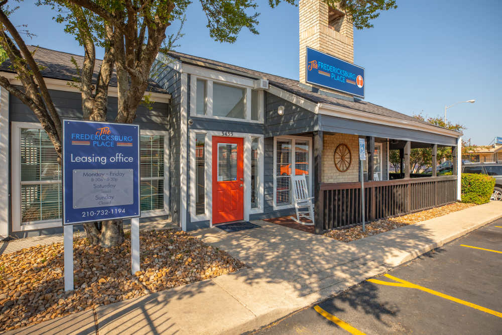 Leasing office and a road at Fredericksburg Place Apartments in San Antonio, Texas