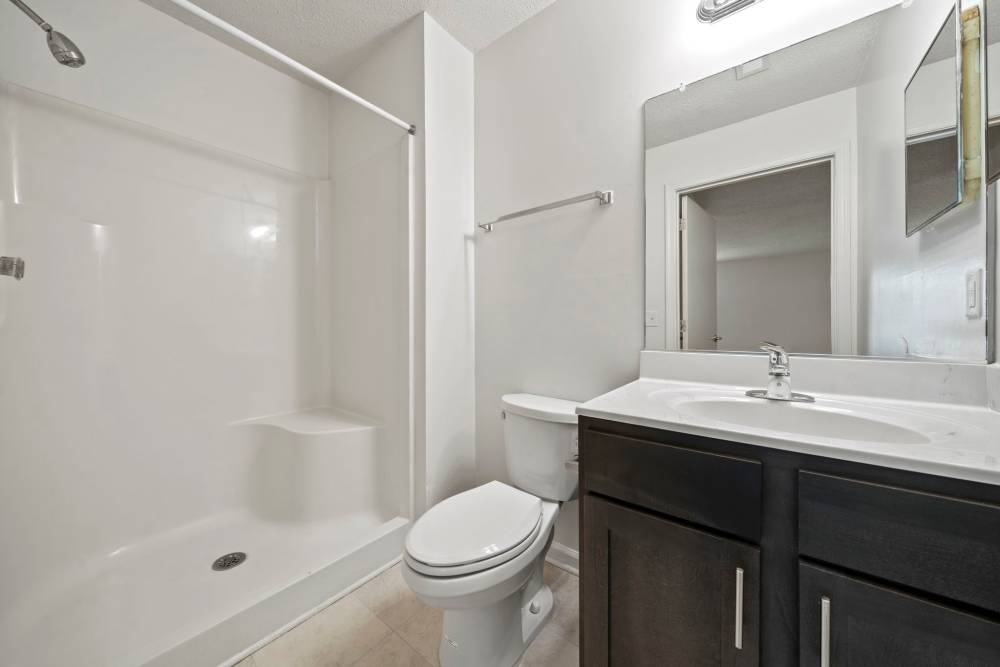 Bathroom with frameless vanity mirror  at Salem Run in Fredericksburg, Virginia
