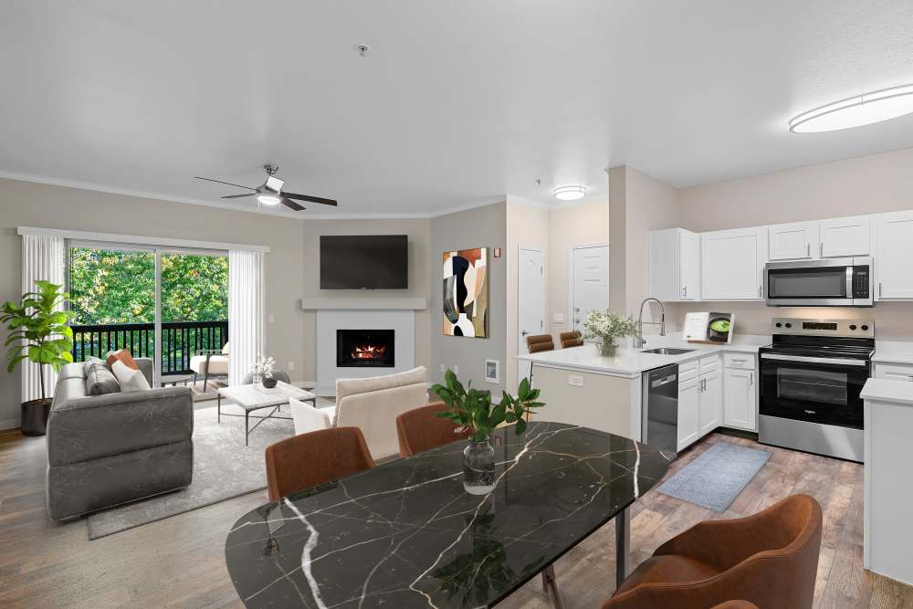 Renovated living room & kitchen with plenty of counter top space at Cortland Village Apartment Homes in Hillsboro, Oregon