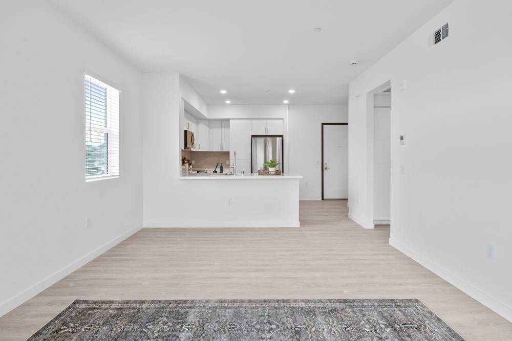 Vibrant living room and kitchen with all the amenities at Canyon Bluffs Apartment Homes in Riverside, California