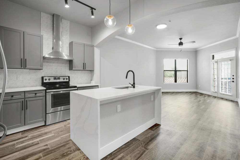Combined view of the kitchen and the living room at The Fitz in Houston, Texas