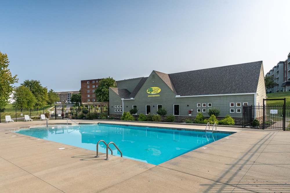 Resort style swimming pool with lounge chairs at Vantage Pointe West Apartment Homes in Cincinnati, Ohio