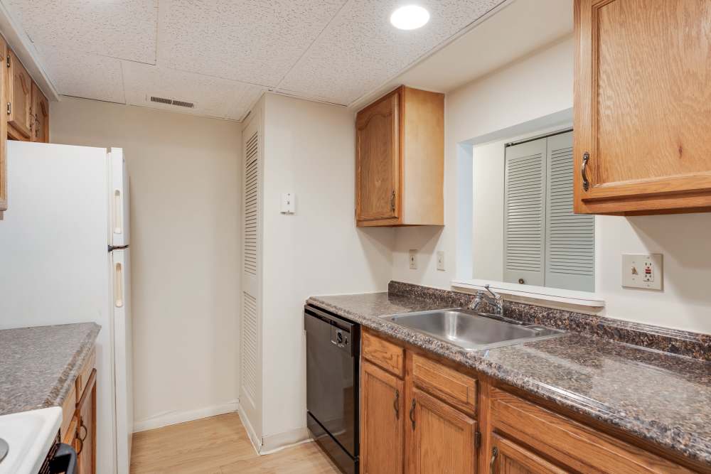 Kitchen with wooden cabinets at Vantage Pointe West Apartment Homes in Cincinnati, Ohio