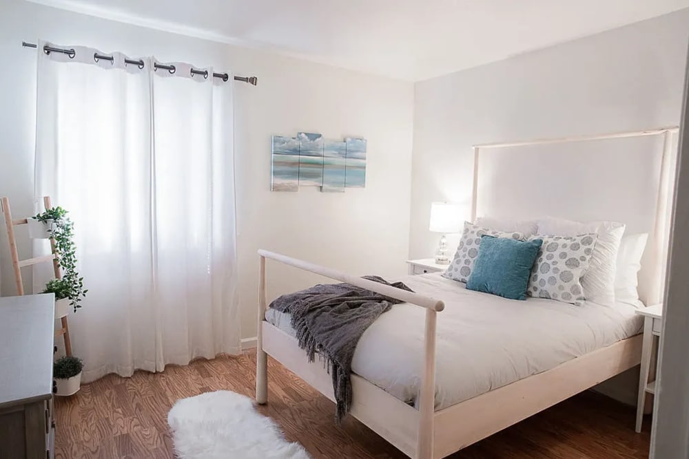 Bedroom with hardwood floors at Walnut Apartments in Santa Rosa, California