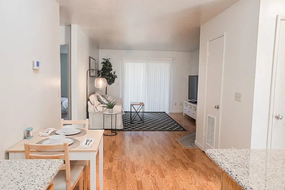 Dining area with view of the living room at Walnut Apartments in Santa Rosa, California