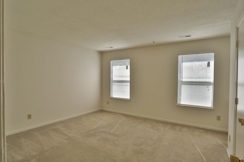 Apartment bedroom with two windows at Chickahominy Bluff in Mechanicsville,Virginia