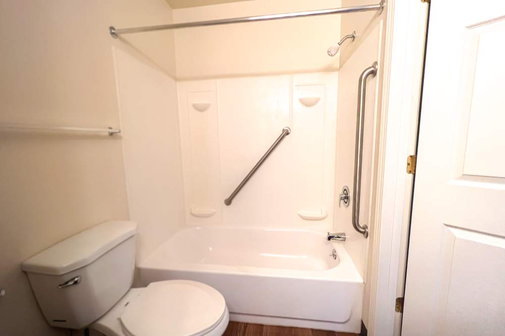 Bathroom with bathtub at Rolling Brook Apartments in Algonac, Michigan