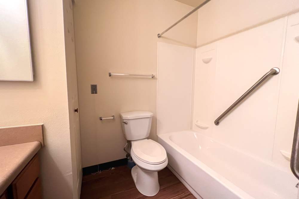 Bathroom with commode at Rolling Brook Apartments in Algonac, Michigan