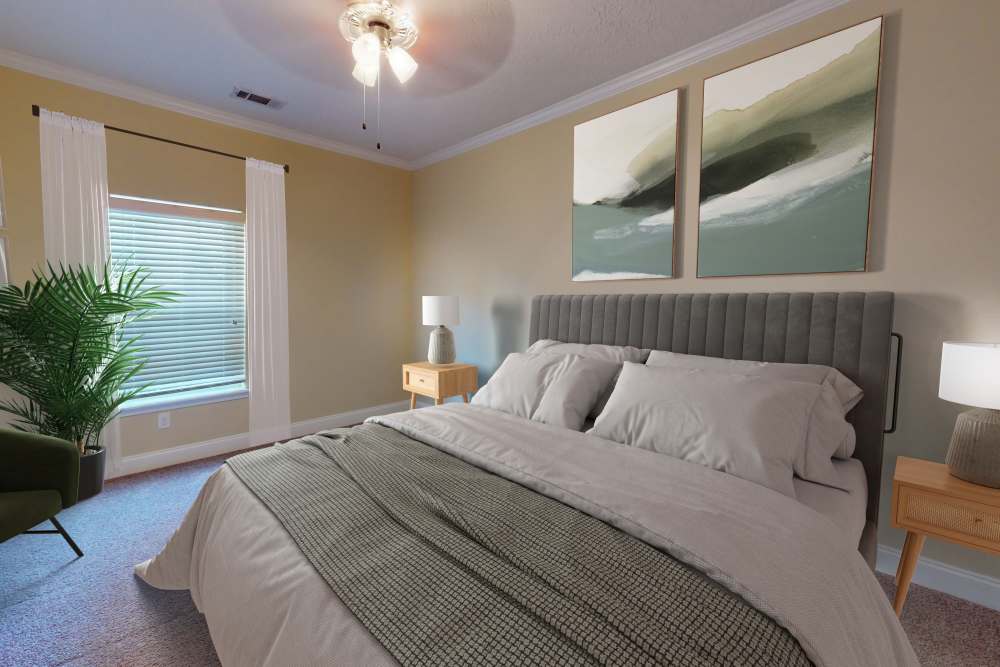 Bedroom with closet and window at Sage Creek Apartments in Augusta, Georgia