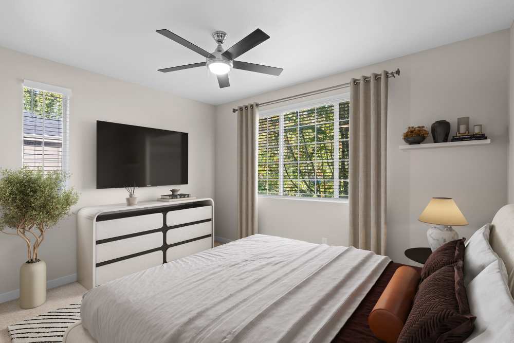 Spacious bedroom with lots of natural light and plush carpeting at Cortland Village Apartment Homes in Hillsboro, Oregon