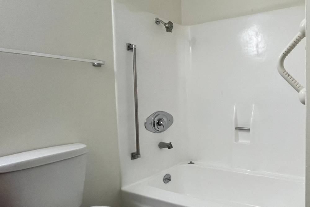 Spacious bathroom with tub at Valley Pride Village in Sylmar, California