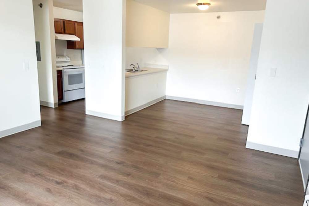 GP 1BDRM- Living Room to Dining Room at Grayling Pines Apartments in Grayling, Michigan