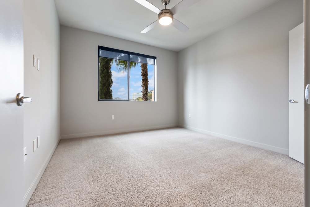 Carpeted bedroom at The George Apartment Homes in Anaheim, California