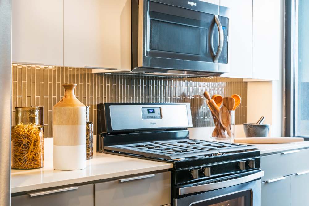 Oven and microwave at The George Apartment Homes in Anaheim, California