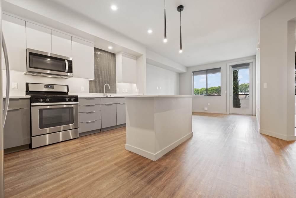 Kitchen with island at The George Apartment Homes in Anaheim, California