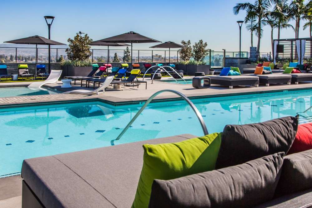 Couches by the pool at The George Apartment Homes in Anaheim, California