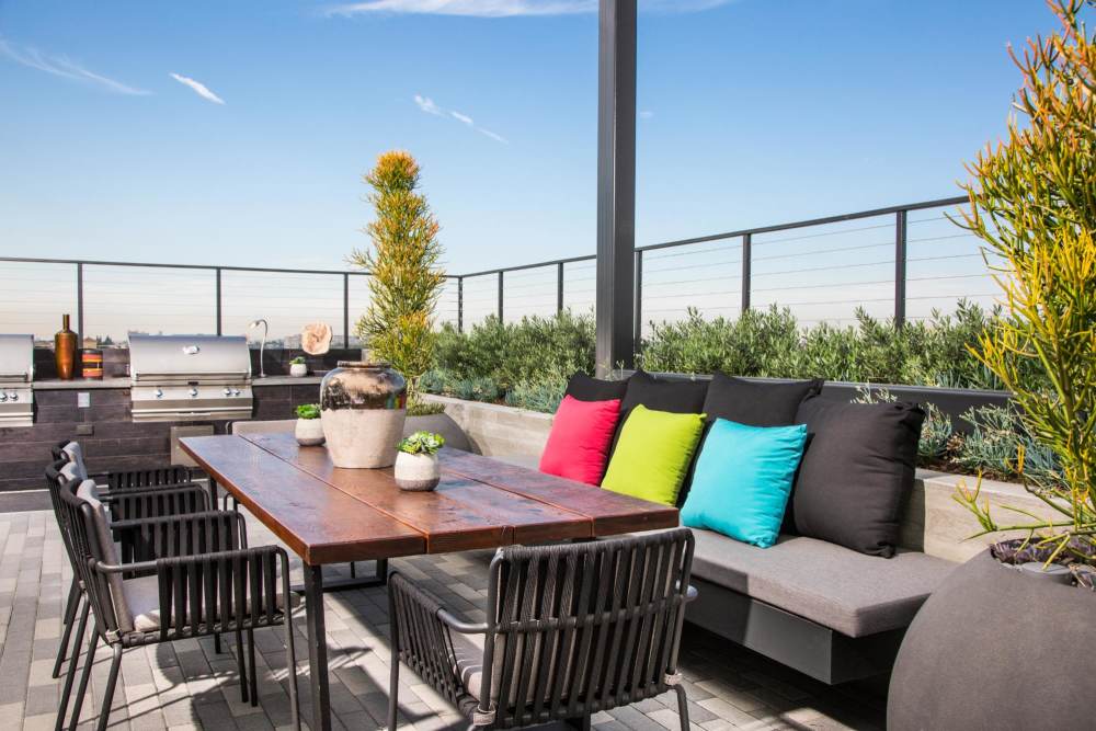Outdoor table and seating at The George Apartment Homes in Anaheim, California