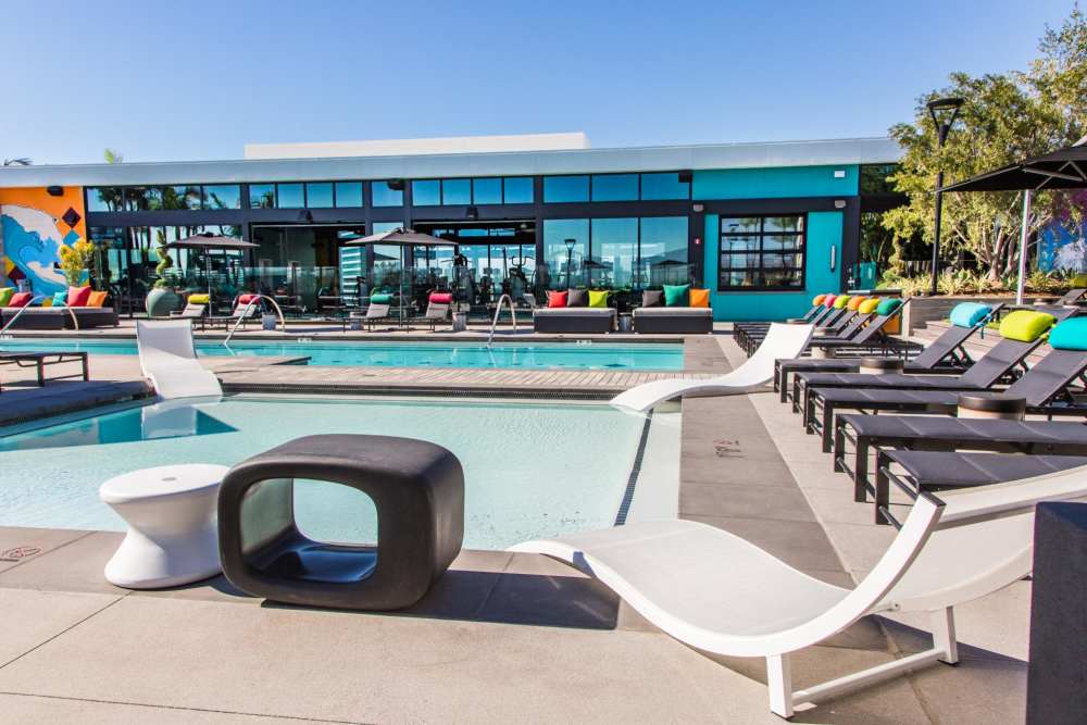 Lots of seating by the pool at The George Apartment Homes in Anaheim, California