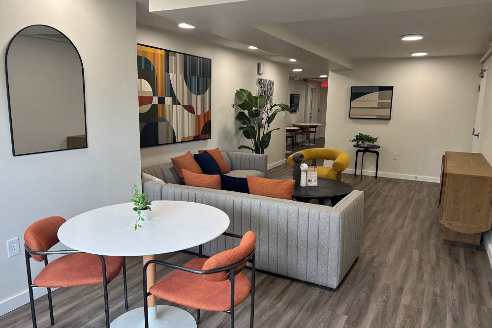 A cozy living room featuring a couch, table, and chairs at Broadview Apartments in Columbia, South Carolina