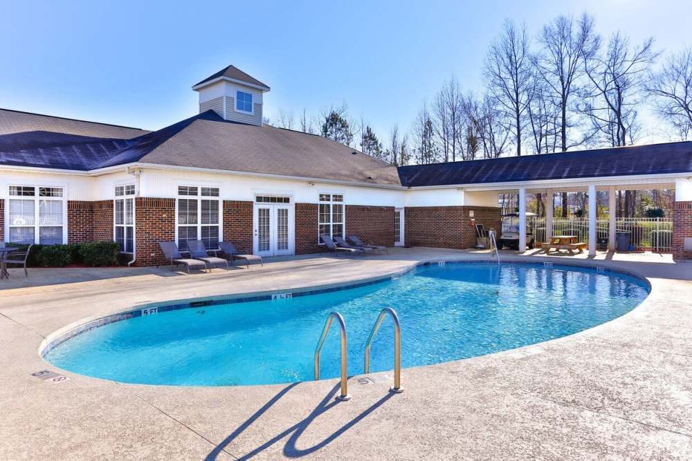 Resort-style swimming pool with lounge chairs at Cowan Farms in Rock Hill, South Carolina