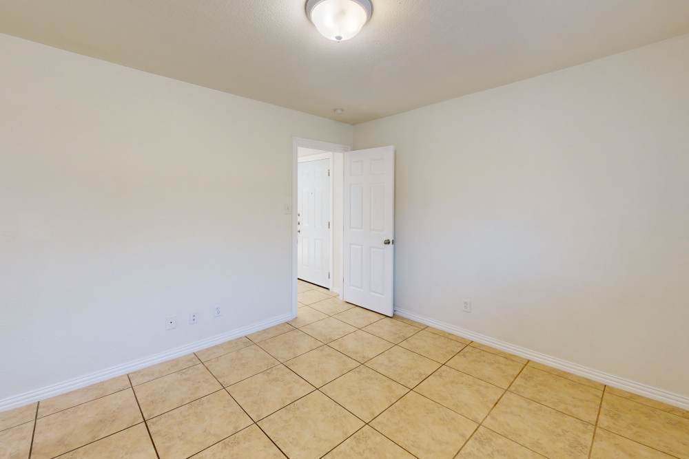 Bedroom 2 at Tucasa Townhomes in Irving, Texas