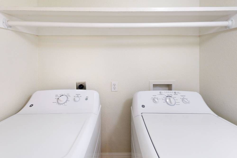 Laundry room at Tucasa Townhomes in Irving, Texas