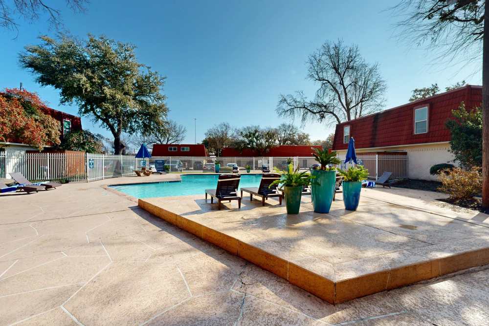 Swimming pool area at Tucasa Townhomes in Irving, Texas