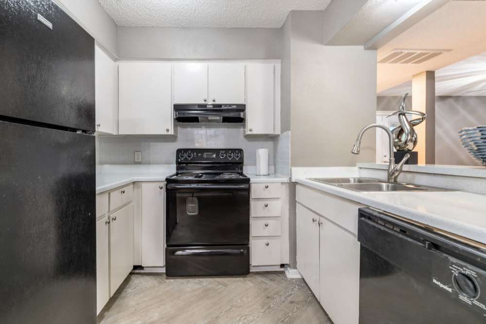 Kitchen at Arbor Park Apartments in Hurst, Texas