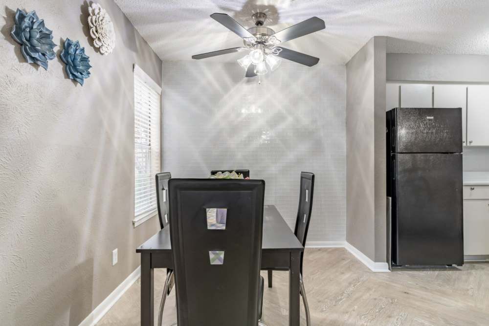 Bathroom with a large mirror and bathtub at Arbor Park Apartments in Hurst, Texas