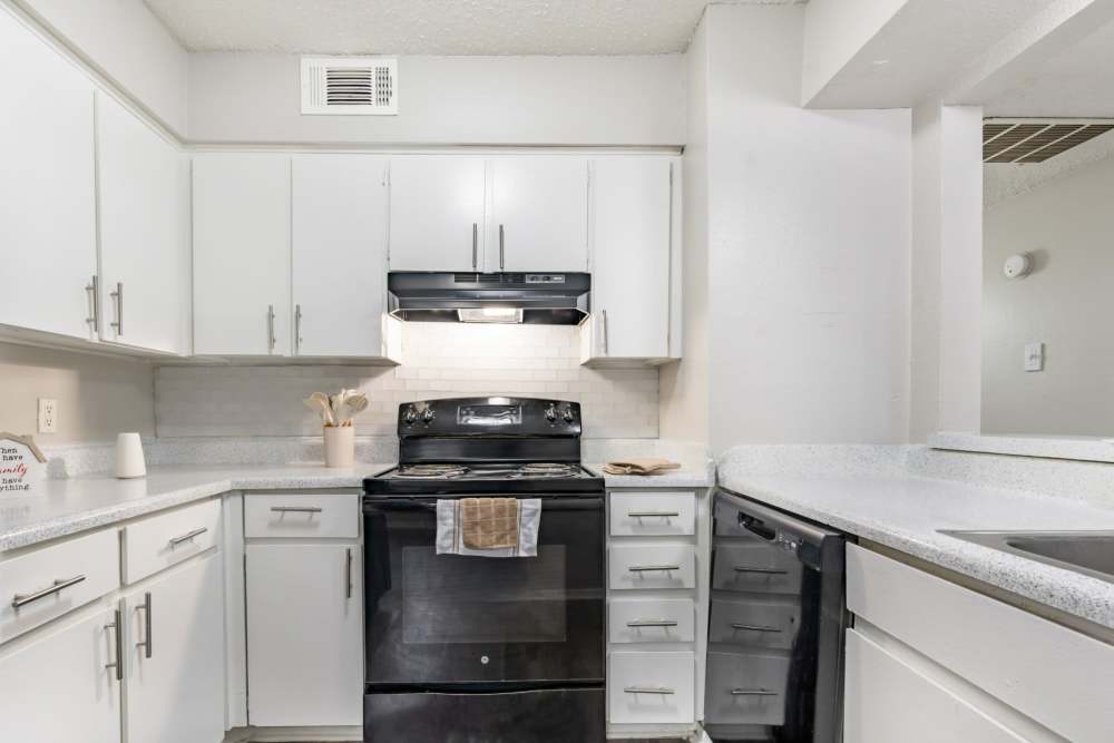 Modern kitchen at Arbor Park Apartments in Hurst, Texas