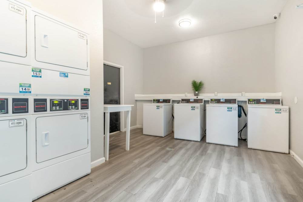 Laundry area at Arbor Park Apartments in Hurst, Texas