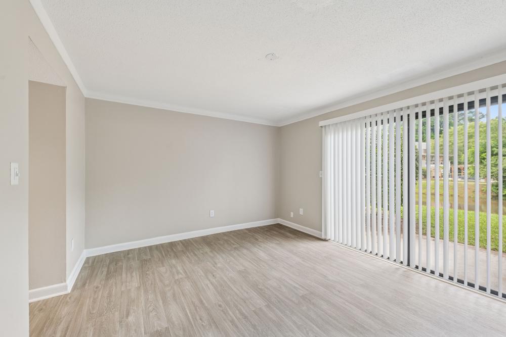 Living room with access to lanai at Pinewood Station in Hillsborough, North Carolina