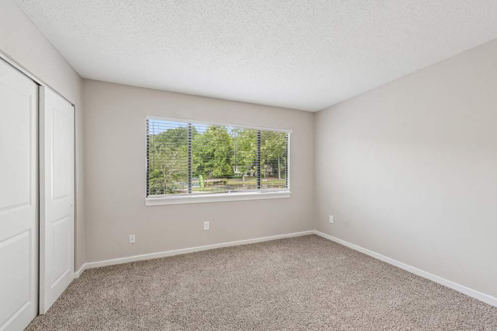Living room with big window at Pinewood Station in Hillsborough, North Carolina