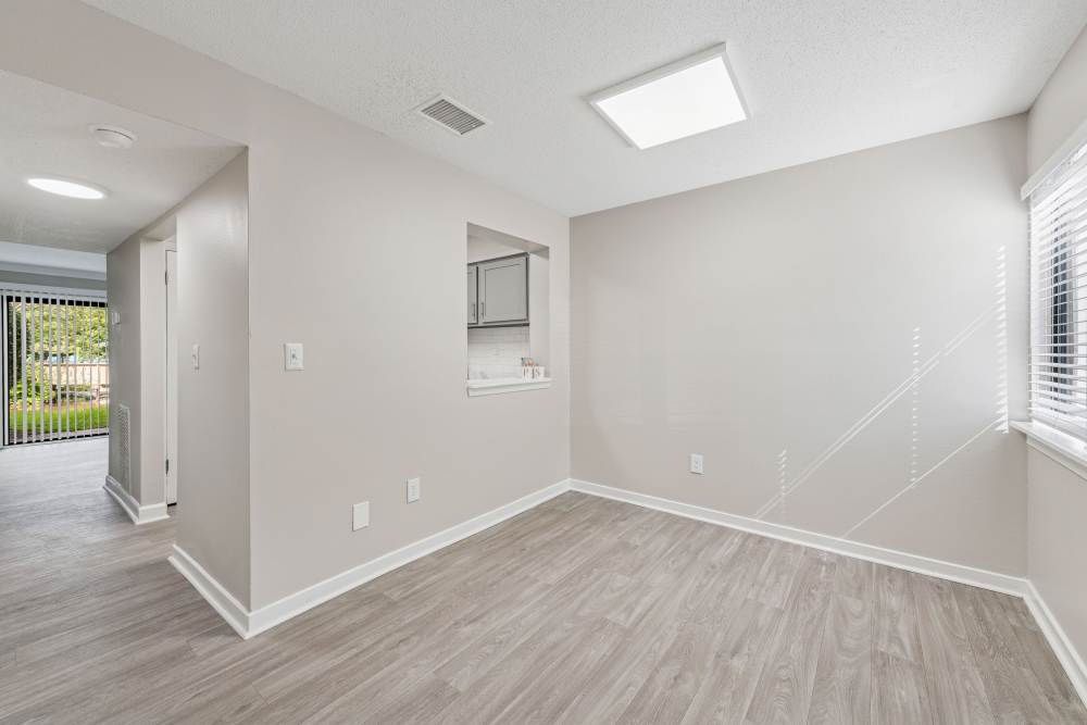 White-painted living room at Pinewood Station in Hillsborough, North Carolina