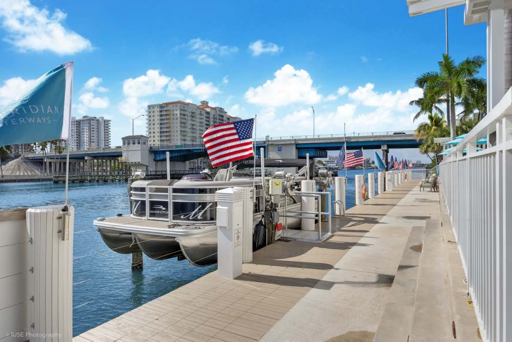 Peaceful waterfront scene with a walking trail at The Meridian at Waterways in Fort Lauderdale, FL