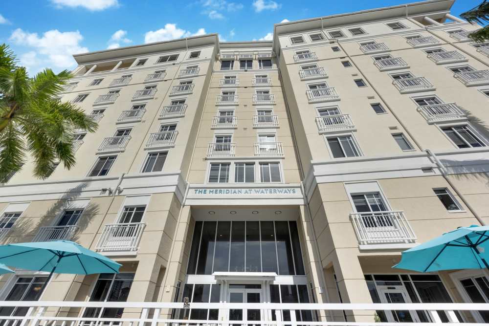 Well-maintained apartment complex with multiple stories and large windows at The Meridian at Waterways in Fort Lauderdale, FL