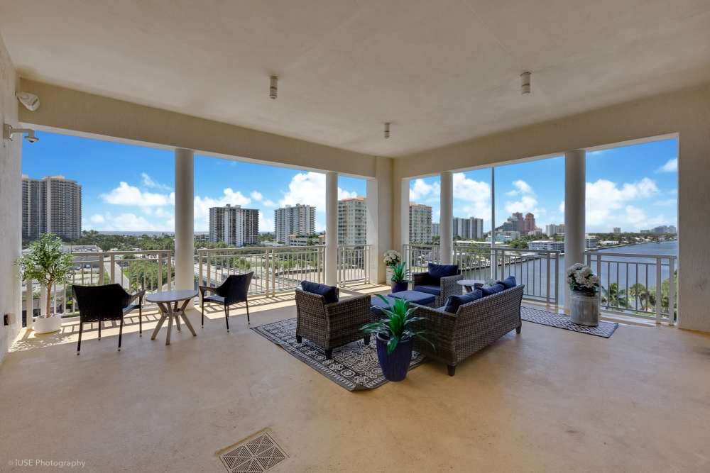 Elegant community area with lounge seating at The Meridian at Waterways in Fort Lauderdale, FL