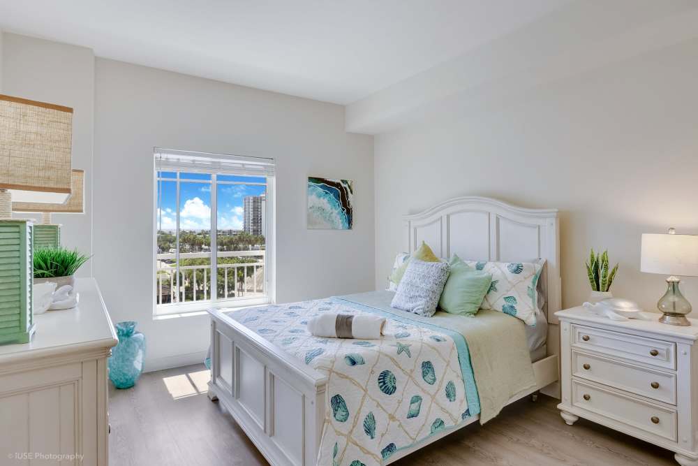 Spacious bedroom with natural light and neutral décor at The Meridian at Waterways in Fort Lauderdale, FL