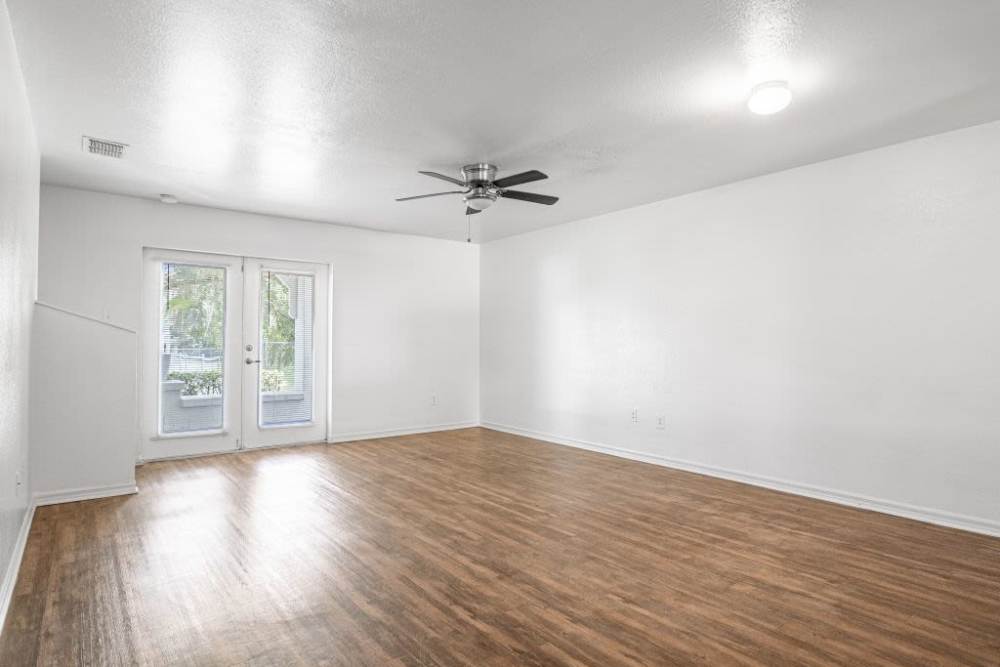 Spacious living room with a sliding door at Cypress Commons in Wildwood, Florida