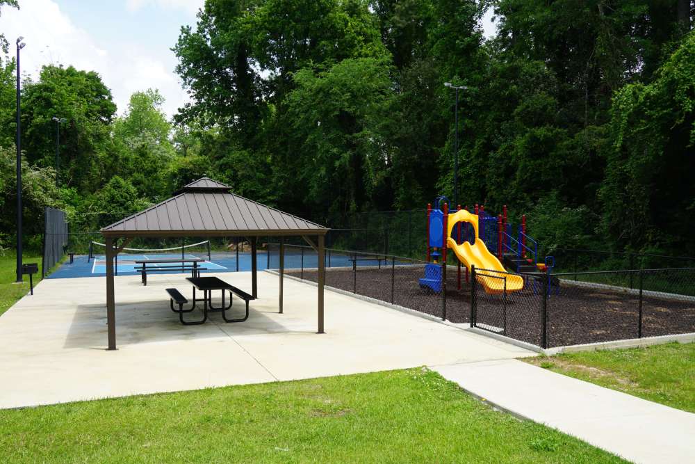 Residents sitting in a park near Cross Creek in Columbus, Georgia