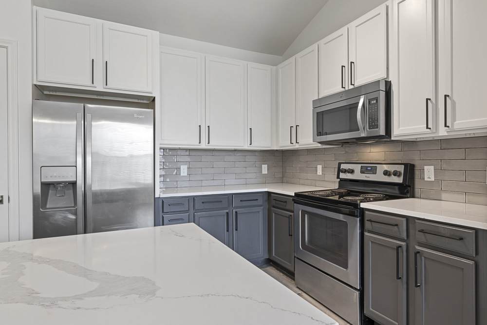 Kitchen with stainless steel appliance at Ashwood in Pflugerville, Texas