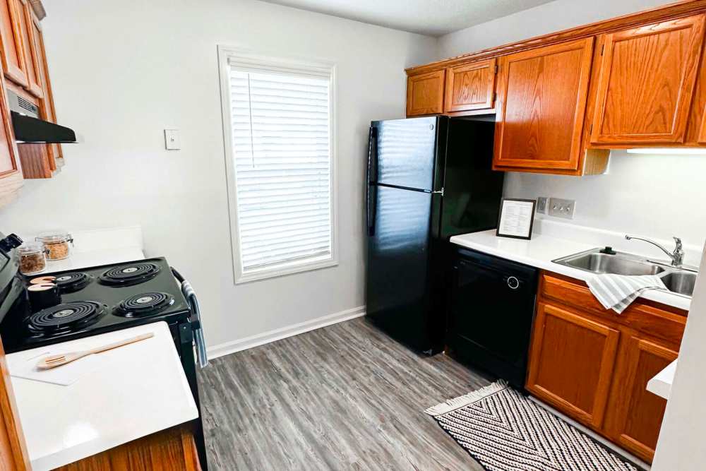 Kitchen with modern finishes and ample storage space at Hudson Woods in Gastonia, North Carolina
