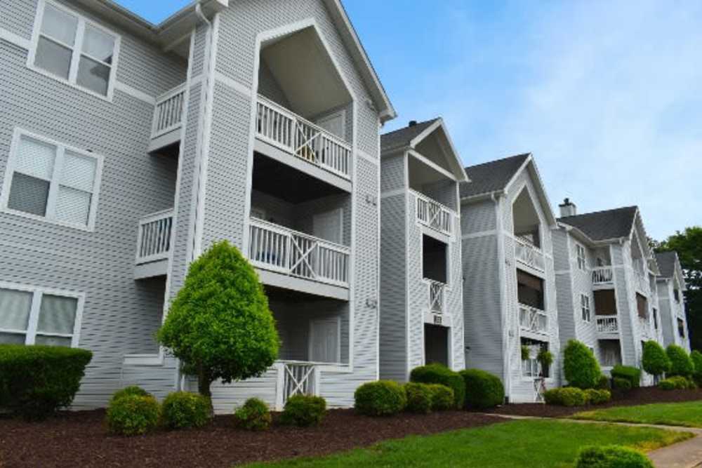 Exterior view of the apartment building with multiple private balconies at Catawba in Belmont, North Carolina