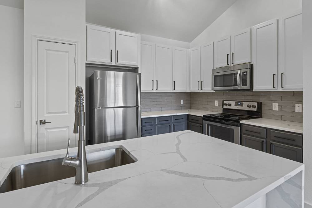 Kitchen with island at Ashwood in Pflugerville, Texas