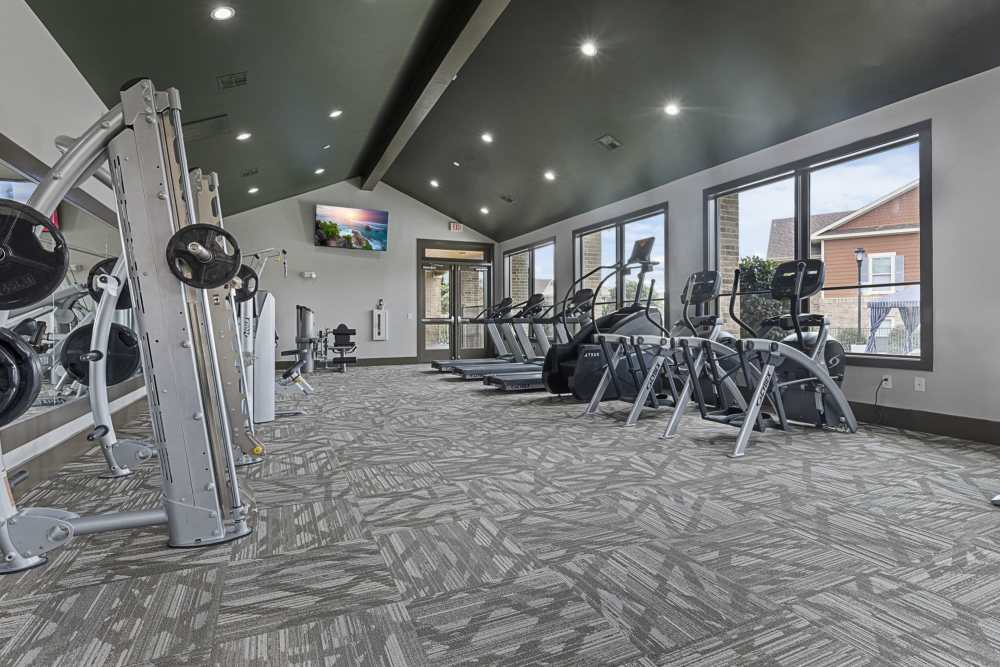 Fitness center with large window at Ashwood in Pflugerville, Texas