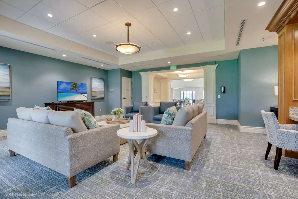 Living room at The Meridian at Boca Raton in Boca Raton, Florida, featuring modern decor and large windows.