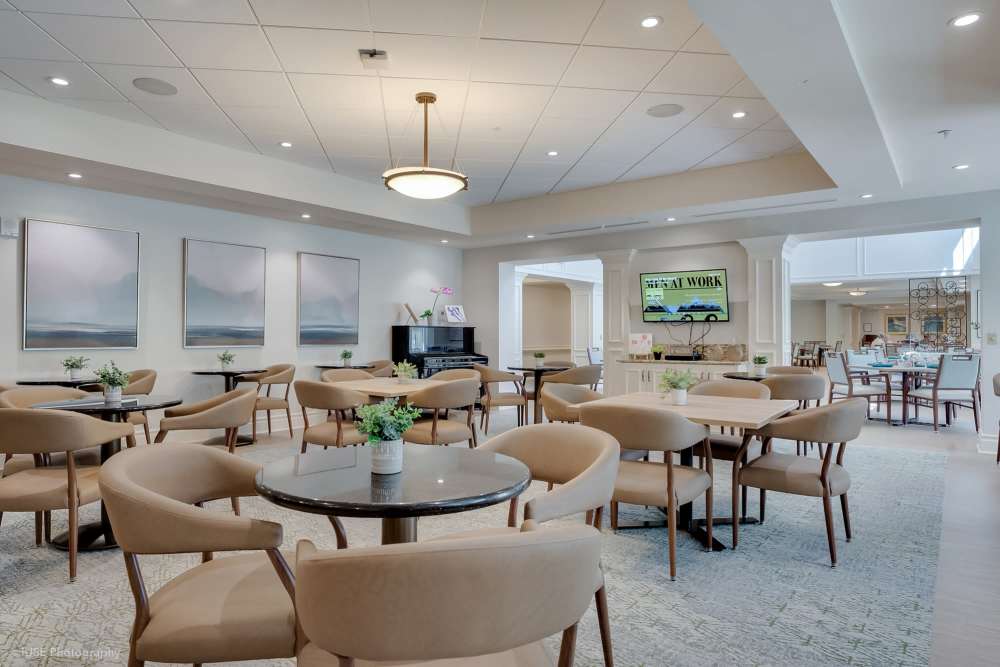 Dining room at the senior living community in Boca Raton, Florida, featuring tables and chairs for residents.