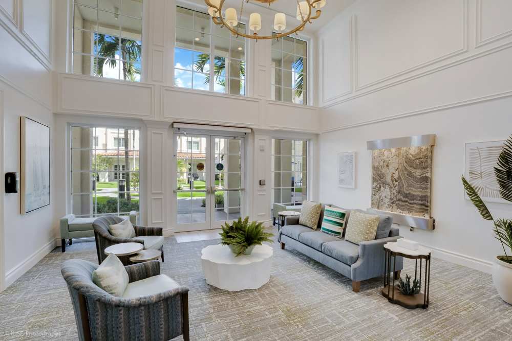 Living room at The Meridian at Boca Raton, featuring modern decor and large windows, located in Boca Raton, Florida.